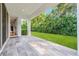 Covered patio with tile flooring and access to a lush green backyard at 808 Sherbourne Cir, Lake Mary, FL 32746