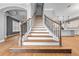 Staircase featuring hardwood steps and decorative railings leading to the upper floors at 808 Sherbourne Cir, Lake Mary, FL 32746