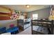 Shared bedroom with two bunkbeds and a Mickey Mouse mural, a fun and functional ' space at 8926 Zurich Ln, Kissimmee, FL 34747
