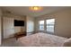 Cozy bedroom featuring a comfortable bed, closet, and natural light from the windows at 8926 Zurich Ln, Kissimmee, FL 34747