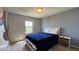 Bedroom with a blue comforter bed and a large mural at 8926 Zurich Ln, Kissimmee, FL 34747