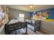 Shared bedroom with two bunkbeds and a Mickey Mouse mural, a fun and functional ' space at 8926 Zurich Ln, Kissimmee, FL 34747