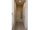 Hallway features a built-in bench with storage and a tiled floor at 8926 Zurich Ln, Kissimmee, FL 34747