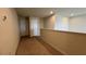 Second floor hallway with neutral walls and carpet, white doors and trim, and recessed lighting at 8926 Zurich Ln, Kissimmee, FL 34747