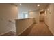 Second floor hallway with neutral walls and carpet, leading to various rooms with recessed lighting at 8926 Zurich Ln, Kissimmee, FL 34747