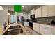 Updated kitchen features granite countertops, stainless steel appliances, and white cabinets at 8926 Zurich Ln, Kissimmee, FL 34747