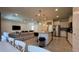 Spacious open-concept living area showcases the kitchen with a large island, stainless steel appliances, and tile flooring at 8926 Zurich Ln, Kissimmee, FL 34747