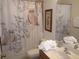 Bathroom with owl themed shower curtain, a mirror, vanity, and decorative accents at 927 Orange Cosmos Blvd, Davenport, FL 33837