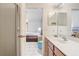 Bathroom view from the bedroom with a vanity, walk-in shower with glass door at 927 Orange Cosmos Blvd, Davenport, FL 33837