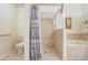 Full bathroom features a shower, a bathtub, tile walls, and tile floors at 927 Orange Cosmos Blvd, Davenport, FL 33837