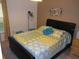 Cozy bedroom with a large bed, patterned bedding, natural light and stylish décor at 927 Orange Cosmos Blvd, Davenport, FL 33837