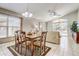 Cozy dining area adjacent to the living room and featuring natural light and neutral decor at 927 Orange Cosmos Blvd, Davenport, FL 33837
