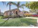 Inviting home exterior featuring a well-manicured lawn and mature trees at 927 Orange Cosmos Blvd, Davenport, FL 33837