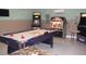 This spacious game room features a pool table, jukebox, and multiple arcade-style video games at 927 Orange Cosmos Blvd, Davenport, FL 33837