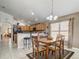 Cozy kitchen with a dining area, modern appliances, and bright natural light at 927 Orange Cosmos Blvd, Davenport, FL 33837