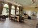 Spacious common living room with large windows, sofas, and stylish décor at 927 Orange Cosmos Blvd, Davenport, FL 33837