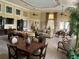 Well-appointed community living room with dining area, comfortable seating, and natural light at 927 Orange Cosmos Blvd, Davenport, FL 33837