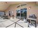 Covered patio features outdoor grill, seating and sliding door access at 927 Orange Cosmos Blvd, Davenport, FL 33837