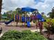 Community playground with swings and slides at 927 Orange Cosmos Blvd, Davenport, FL 33837