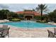 Community pool with ample seating and landscaping at 927 Orange Cosmos Blvd, Davenport, FL 33837