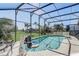 Screened pool with chair lift for accessibility and clear views to the large lawn and landscaping at 927 Orange Cosmos Blvd, Davenport, FL 33837
