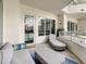 Comfortable outdoor seating on the balcony provides a place to enjoy stunning city views at 100 S Eola Dr # 611, Orlando, FL 32801