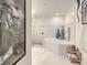 A bright bathroom space featuring a modern tub, a glass shower, and unique artwork at 100 S Eola Dr # 611, Orlando, FL 32801
