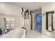Modern bathroom featuring a luxurious tub, unique artwork, and ample storage space at 100 S Eola Dr # 611, Orlando, FL 32801