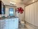 Bathroom features a granite vanity, updated fixtures, and a shower-tub combination with new tile at 100 S Eola Dr # 611, Orlando, FL 32801