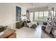 Bright bedroom with large windows, modern furnishings, and a cozy seating area at 100 S Eola Dr # 611, Orlando, FL 32801