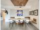 Dining area features modern lighting, custom bench seating, tile floors and unique decorative accents at 100 S Eola Dr # 611, Orlando, FL 32801