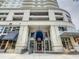 Elegant condominium entrance with a covered walkway, glass doors, and convenient access to shops at 100 S Eola Dr # 611, Orlando, FL 32801