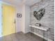 Bright entryway featuring modern decor, a stylish console table, and unique wall art at 100 S Eola Dr # 611, Orlando, FL 32801