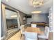 Resident game room with a pool table, table and chairs, modern lighting, and ample space for socializing at 100 S Eola Dr # 611, Orlando, FL 32801
