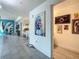 Open hallway boasts unique artwork and an open floor plan into the kitchen and other rooms at 100 S Eola Dr # 611, Orlando, FL 32801