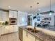 Open kitchen with stainless steel appliances and granite countertops, flowing into the dining area at 100 S Eola Dr # 611, Orlando, FL 32801