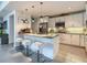 Stylish kitchen features granite counters, stainless appliances, white cabinets, and island seating at 100 S Eola Dr # 611, Orlando, FL 32801