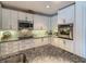 Bright kitchen with white cabinets, stainless steel appliances, granite countertops, and modern backsplash at 100 S Eola Dr # 611, Orlando, FL 32801