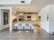 The kitchen features white cabinetry, granite countertops, and stainless steel appliances at 100 S Eola Dr # 611, Orlando, FL 32801