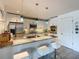 Bright, well-equipped kitchen with granite countertops, stainless steel appliances, and bar stool seating at 100 S Eola Dr # 611, Orlando, FL 32801