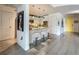 Modern kitchen featuring white cabinetry, a breakfast bar, and pendant lighting, with an adjacent doorway at 100 S Eola Dr # 611, Orlando, FL 32801