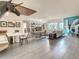Bright, open-concept living and dining area with modern decor, art, and tile floors in a condo at 100 S Eola Dr # 611, Orlando, FL 32801