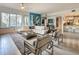 Stylish living room boasts a spacious layout, chic decor, and an adjacent kitchen with bar seating at 100 S Eola Dr # 611, Orlando, FL 32801