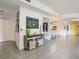 Bright living room with open floor plan and modern decor that leads into the kitchen with bar seating at 100 S Eola Dr # 611, Orlando, FL 32801