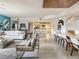 Spacious open-concept living room flows into a dining area and kitchen with contemporary furnishings at 100 S Eola Dr # 611, Orlando, FL 32801