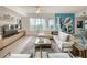 Bright living space with modern furnishings, cityscape views, and unique art creating a vibrant ambiance at 100 S Eola Dr # 611, Orlando, FL 32801