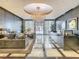 Grand lobby with marble floors, a dazzling chandelier, reception desk and comfortable seating at 100 S Eola Dr # 611, Orlando, FL 32801