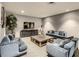 Cozy lounge area with sofas, accent chairs, television, and modern decor for residents to relax at 100 S Eola Dr # 611, Orlando, FL 32801