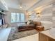Bright bedroom featuring a modern bed frame, a balcony view, and stylish wall accents at 100 S Eola Dr # 611, Orlando, FL 32801