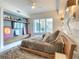 Cozy bedroom featuring a modern bed frame, a balcony view, and stylish wall accents at 100 S Eola Dr # 611, Orlando, FL 32801